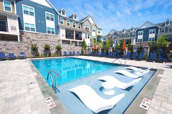 Outdoor heated pool with tanning ledge and spa
